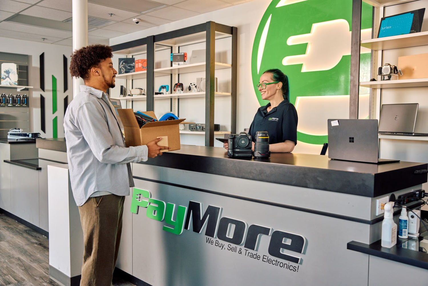 paymore employee inspecting electronics